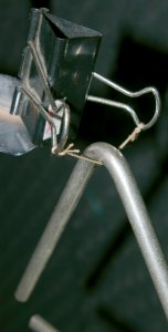 Bulldog clip mounting for a triangle